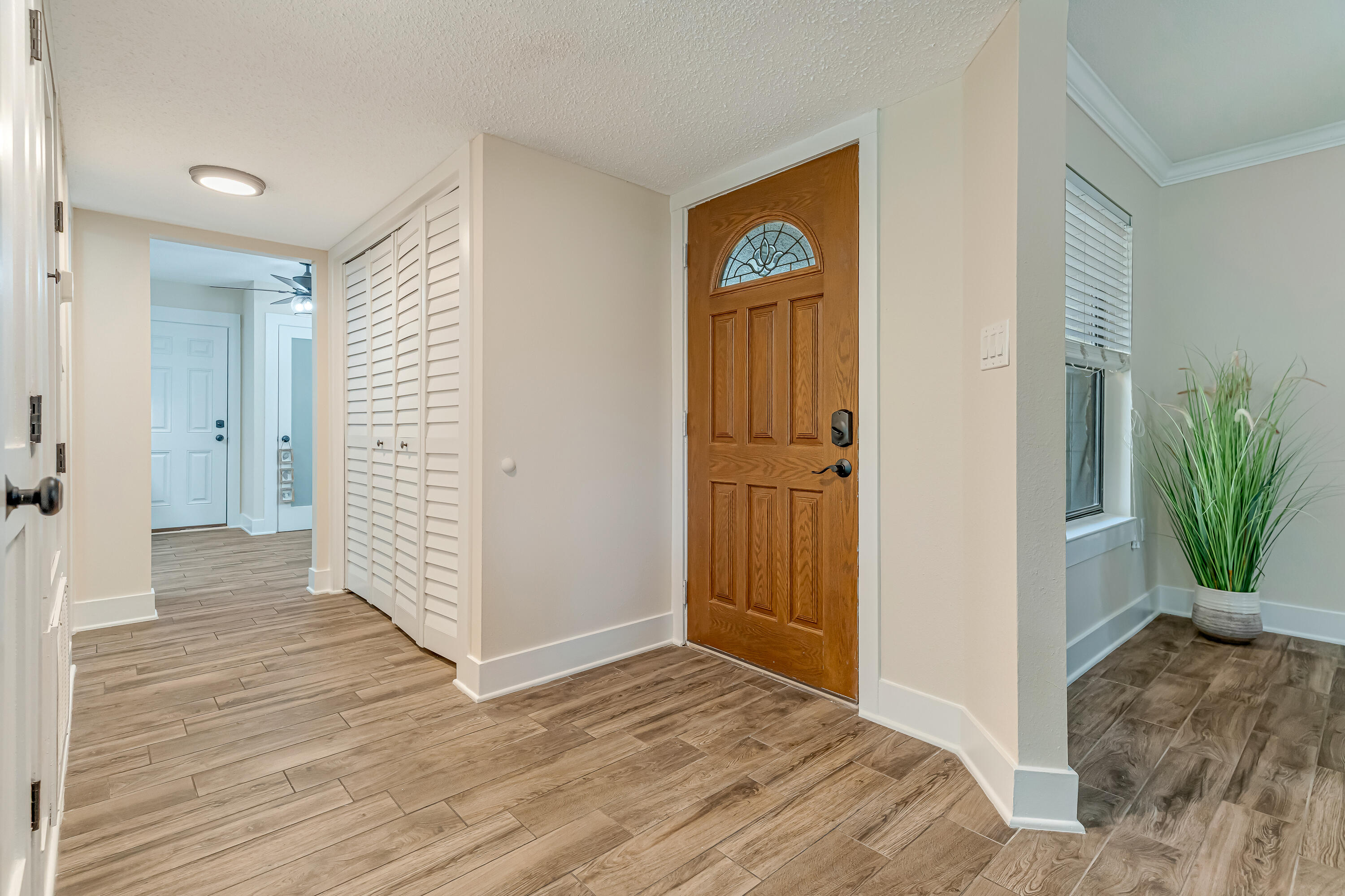 274 Kidd Street Fort Walton Beach, FL 32548 - Photo 48 of 74 a view of a hallway with wooden floor and front door