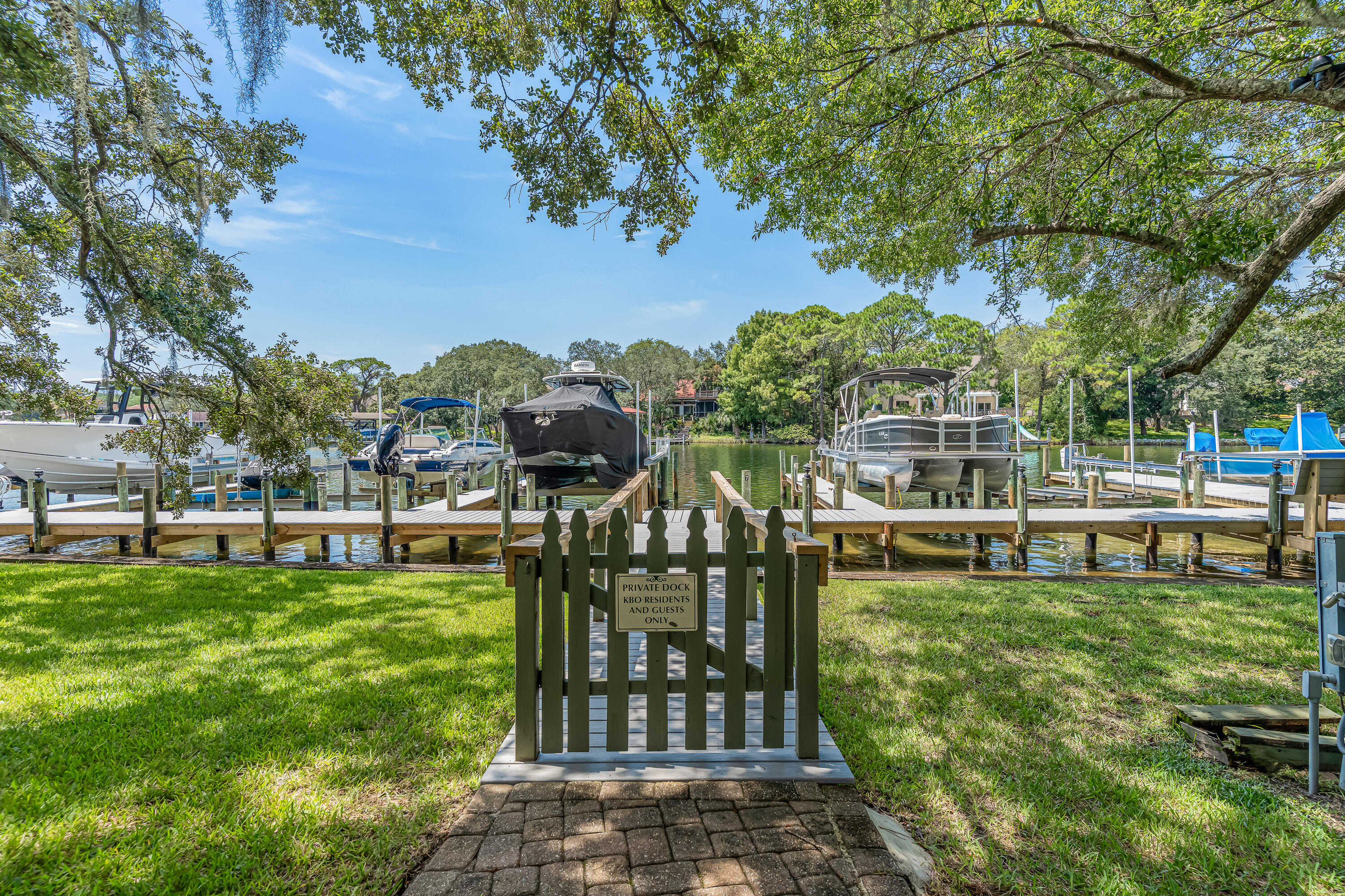 274 Kidd Street Fort Walton Beach, FL 32548 - Photo 58 of 74 a view of a swimming pool with a bench and trees around