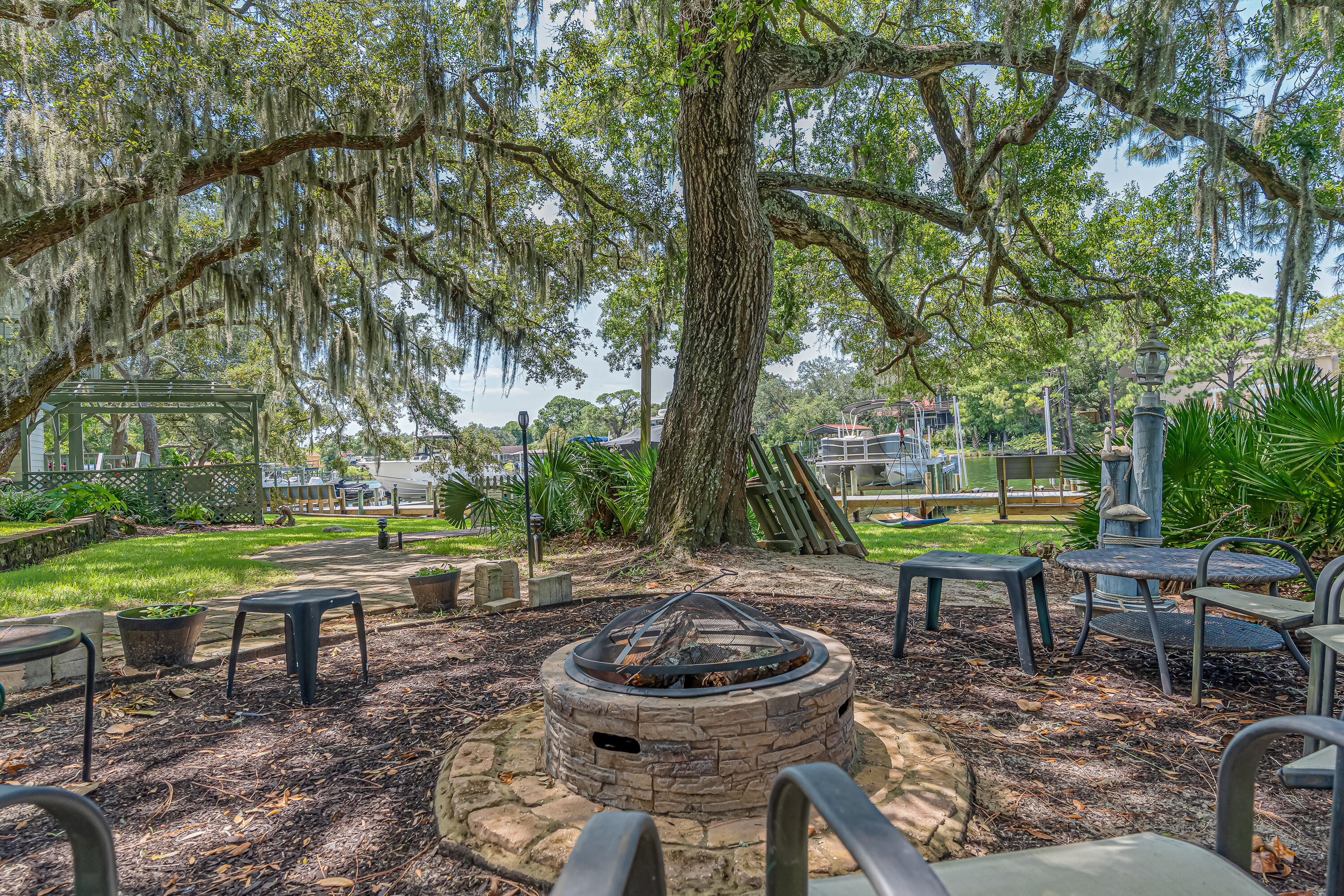 274 Kidd Street Fort Walton Beach, FL 32548 - Photo 60 of 74 a backyard of a house with barbeque oven table and chairs