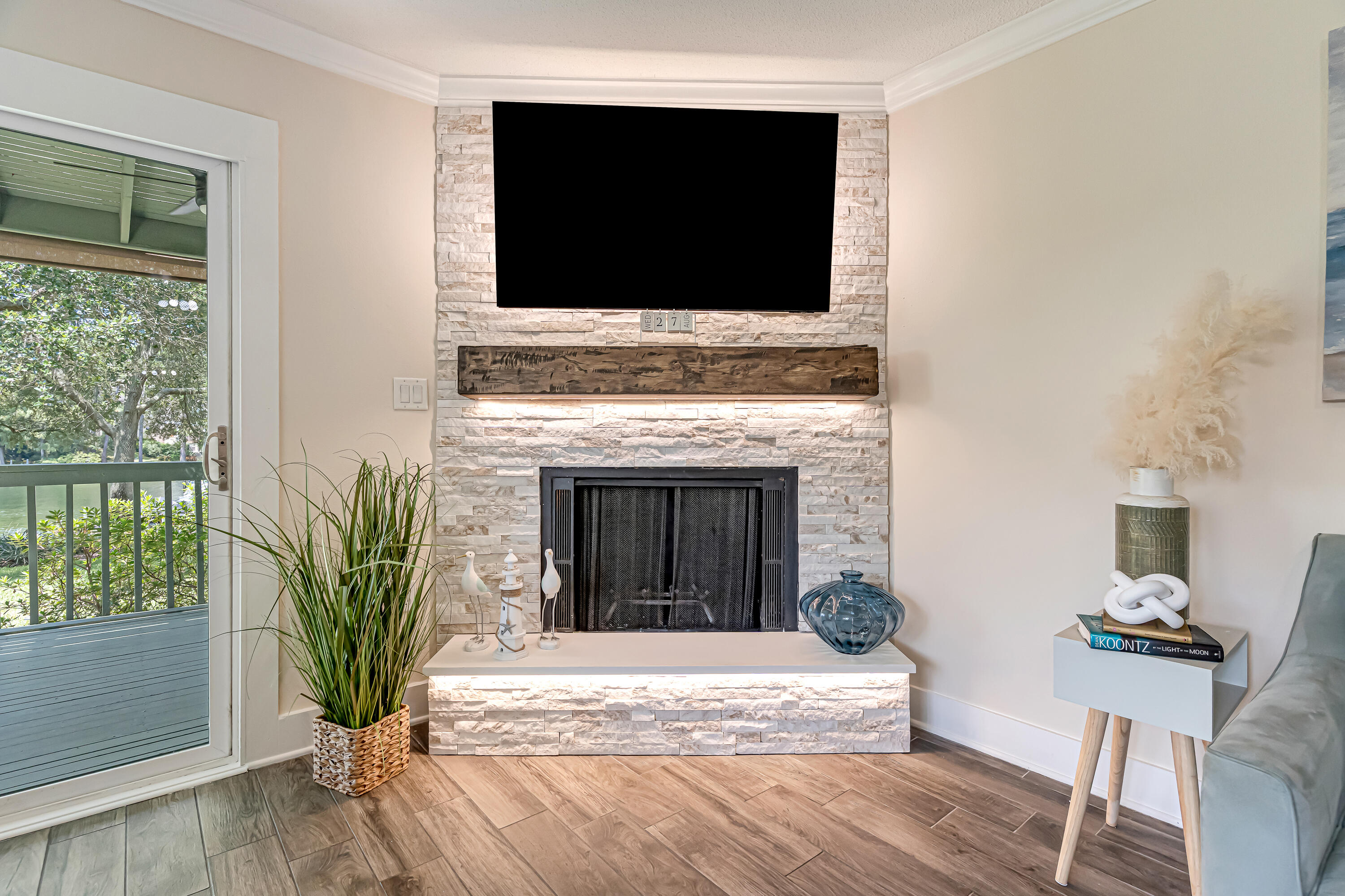 274 Kidd Street Fort Walton Beach, FL 32548 - Photo 7 of 74 a living room with a flat screen tv and a fireplace