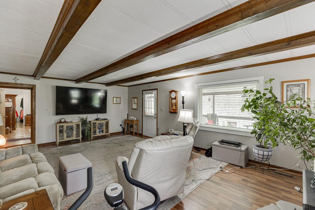 722 Charlie Morris Road Colbert, GA 30628 - Photo 11 of 78 a living room with furniture and a flat screen tv