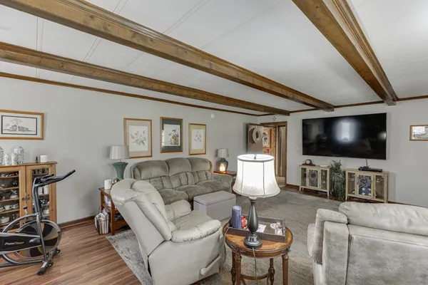 a kitchen that has a lot of cabinets in it and appliances