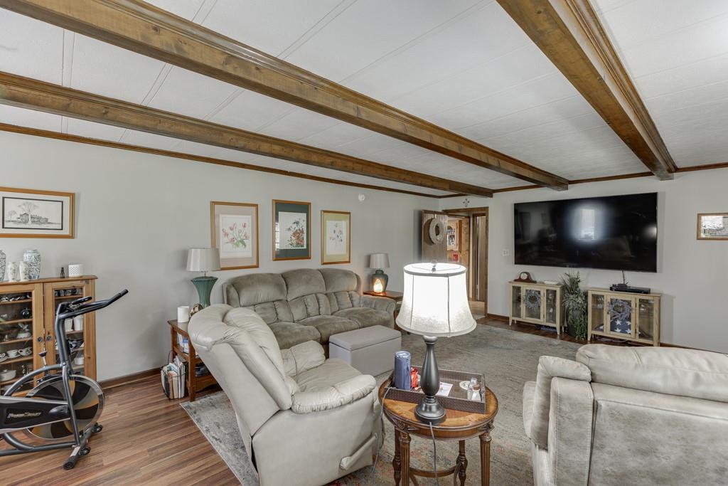722 Charlie Morris Road Colbert, GA 30628 - Photo 12 of 78 a living room with furniture and a flat screen tv
