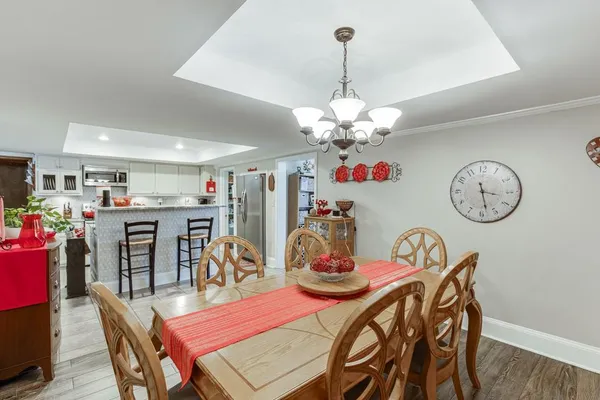 a bedroom with furniture and a wooden floor