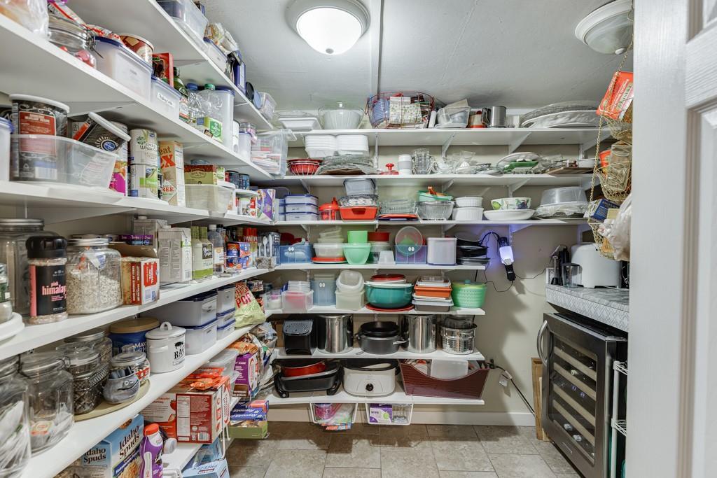 722 Charlie Morris Road Colbert, GA 30628 - Photo 22 of 78 a room with lots of different colored cloths