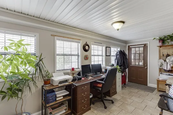 a view of walk in closet with clothes