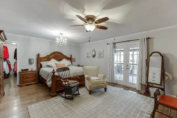 a bedroom with a bed and cabinets