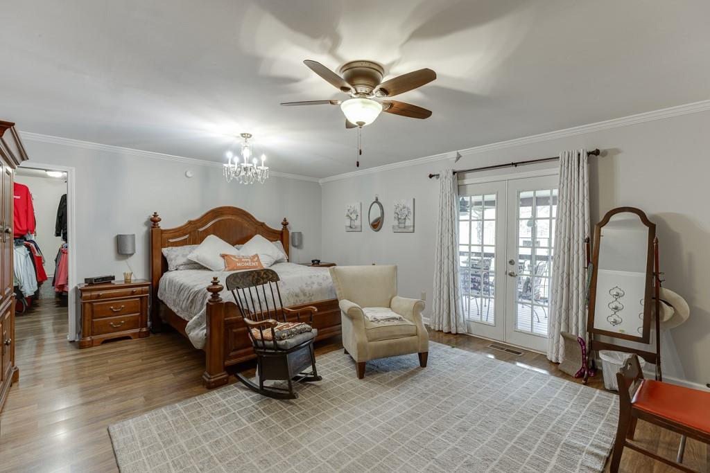 722 Charlie Morris Road Colbert, GA 30628 - Photo 25 of 78 a bedroom with furniture and a window