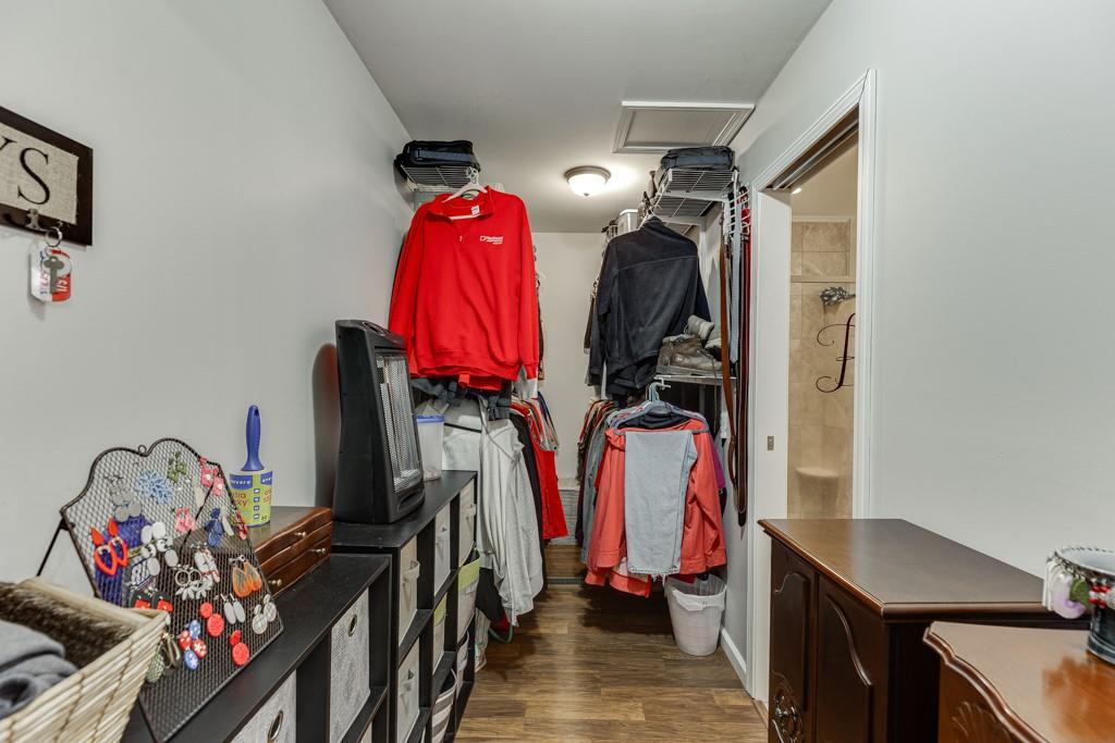 722 Charlie Morris Road Colbert, GA 30628 - Photo 29 of 78 a view of walk in closet with clothes
