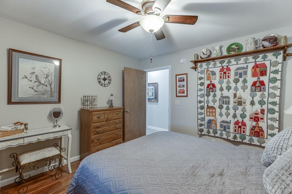 722 Charlie Morris Road Colbert, GA 30628 - Photo 35 of 78 a bedroom with a bed and cabinets