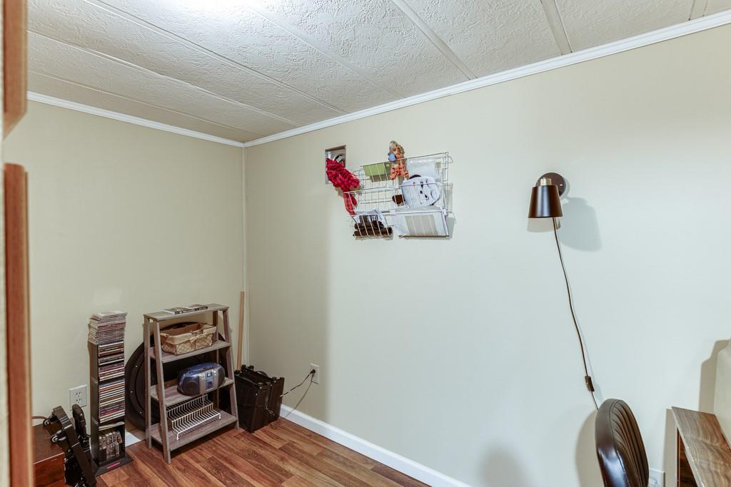 722 Charlie Morris Road Colbert, GA 30628 - Photo 38 of 78 a view of a hallway with workspace