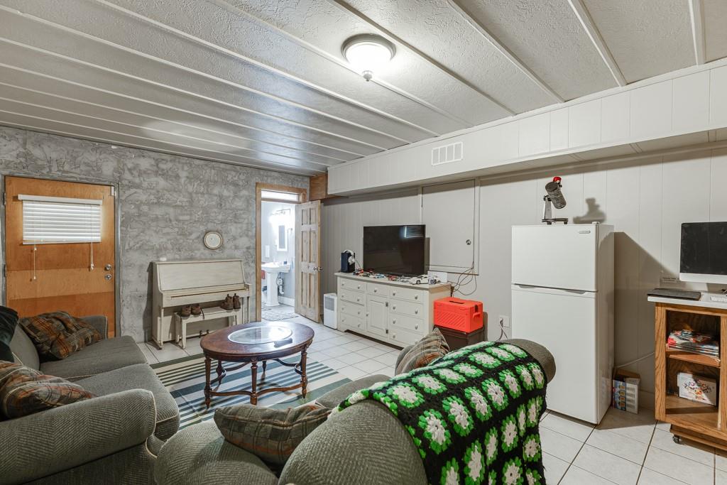 722 Charlie Morris Road Colbert, GA 30628 - Photo 42 of 78 a living room with furniture and a flat screen tv