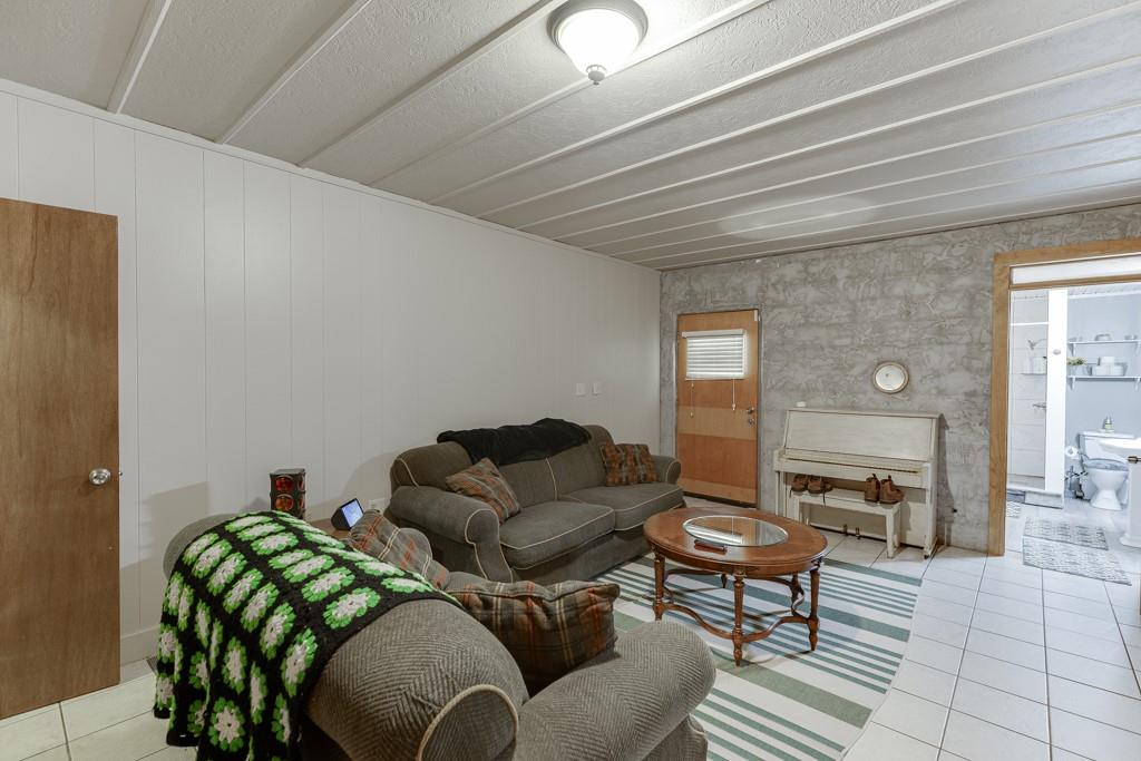 722 Charlie Morris Road Colbert, GA 30628 - Photo 43 of 78 a living room with furniture and wooden floor