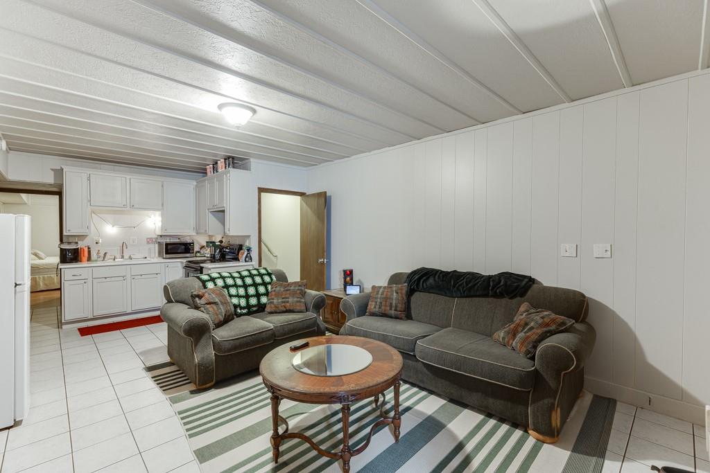 722 Charlie Morris Road Colbert, GA 30628 - Photo 45 of 78 a living room with furniture and a view of kitchen