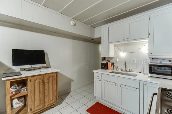 a view of a lake in between the bunch of trees