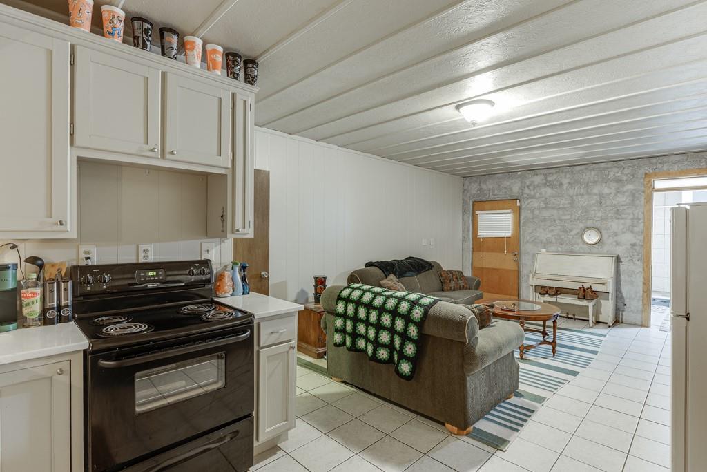722 Charlie Morris Road Colbert, GA 30628 - Photo 49 of 78 a kitchen with furniture a stove and a refrigerator
