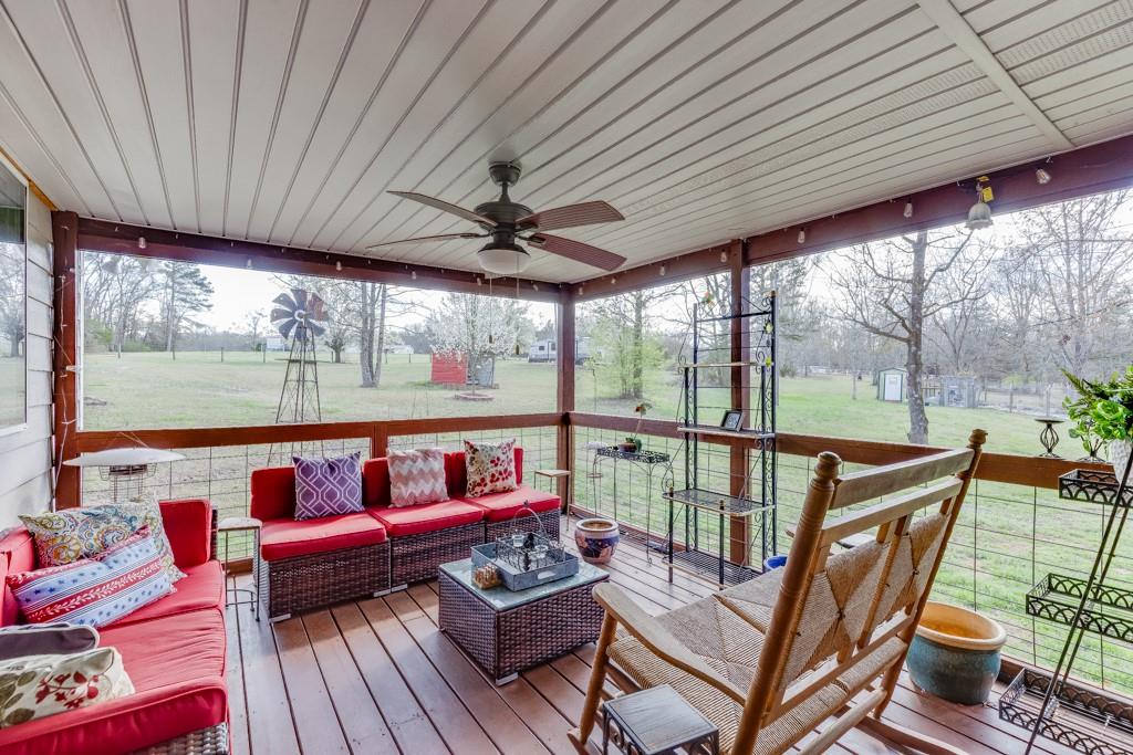 722 Charlie Morris Road Colbert, GA 30628 - Photo 8 of 78 a roof deck with wooden floor and outdoor seating