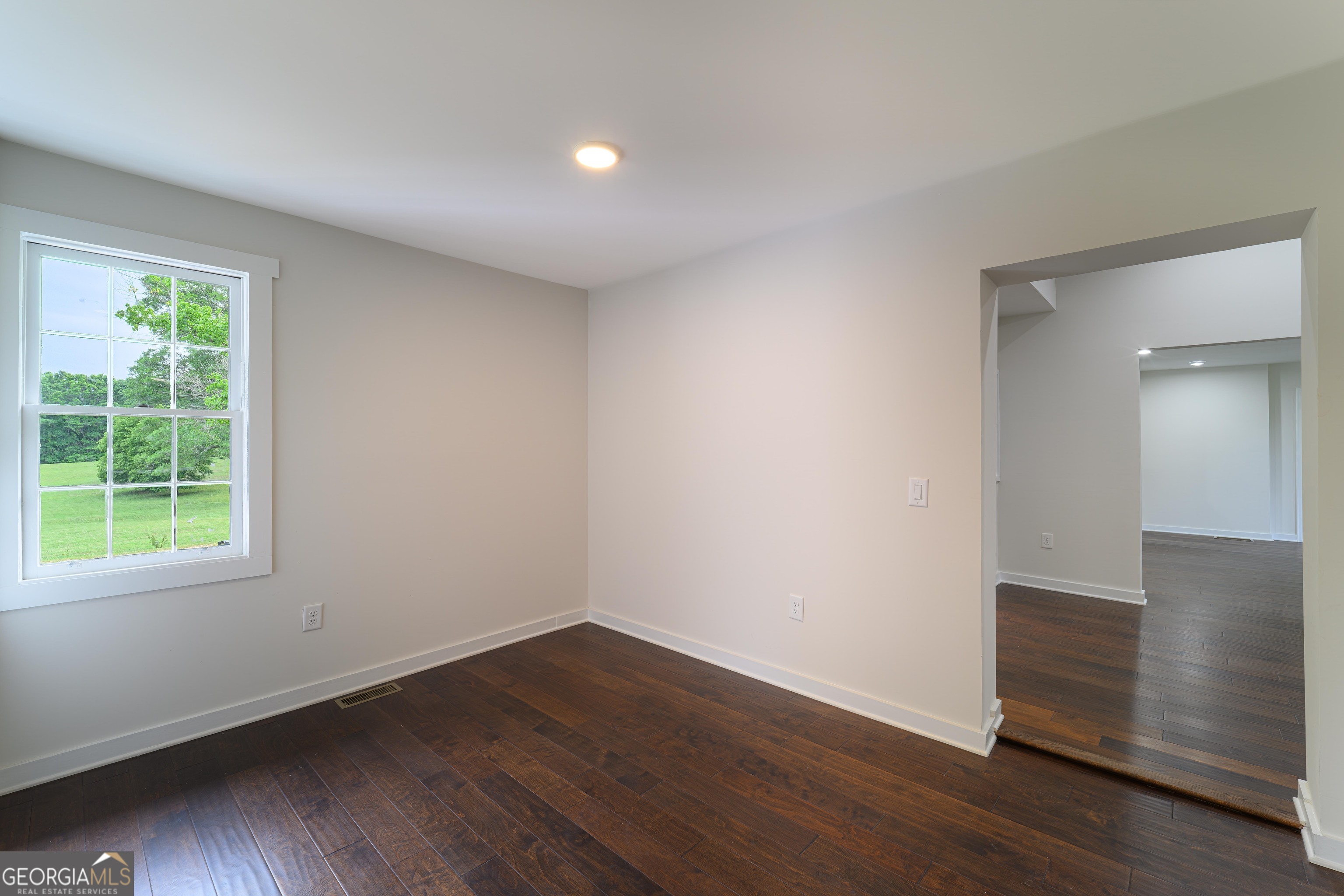 418 Lamb Road Moreland, GA 30259 - Photo 16 of 32 an empty room with wooden floor and windows