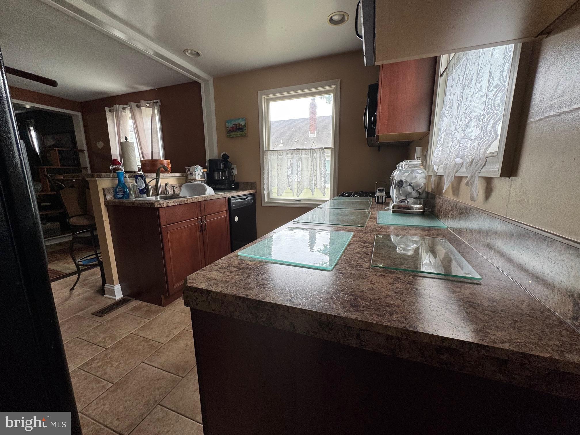320 Harding Avenue Baltimore, MD 21220 - Photo 11 of 23 a kitchen with a sink and a refrigerator
