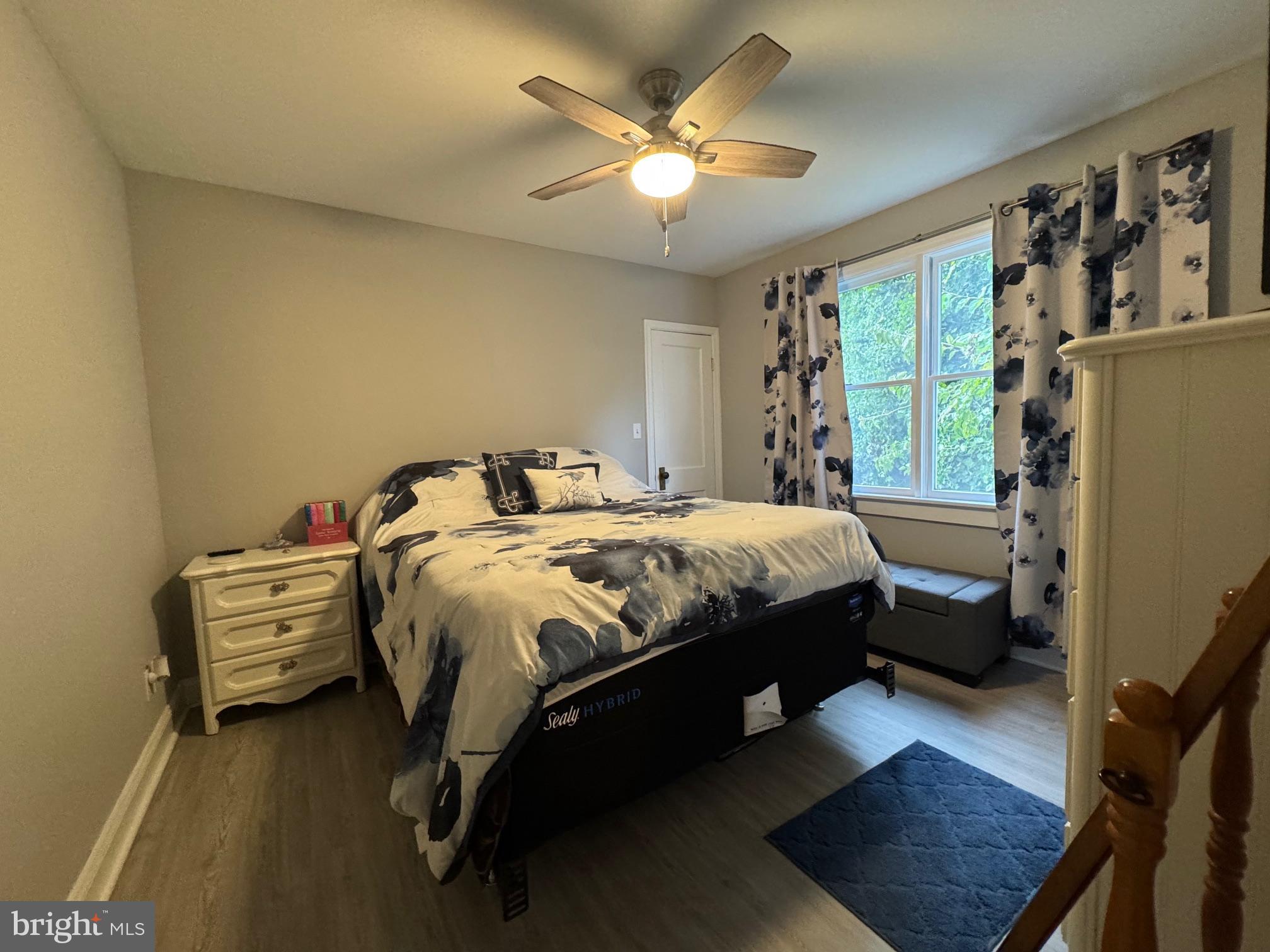 320 Harding Avenue Baltimore, MD 21220 - Photo 12 of 23 a bedroom with a bed dresser and a window