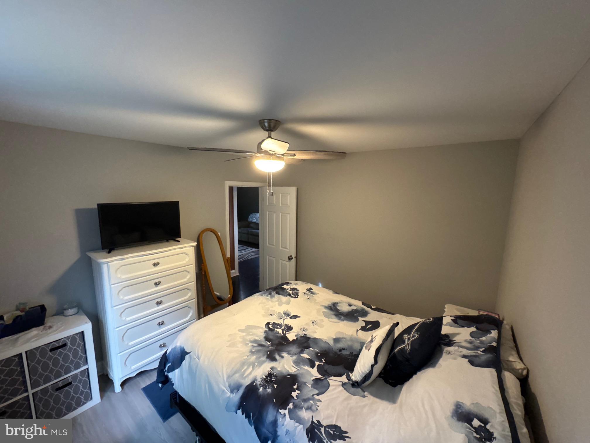 320 Harding Avenue Baltimore, MD 21220 - Photo 13 of 23 a bedroom with a bed and a flat screen tv