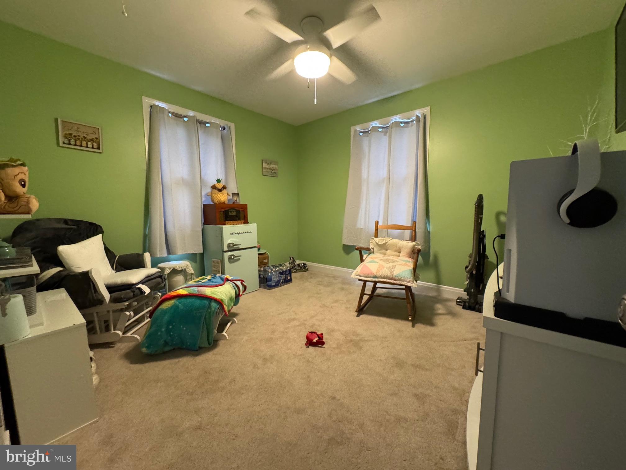 320 Harding Avenue Baltimore, MD 21220 - Photo 15 of 23 a bedroom with a bed and a chandelier