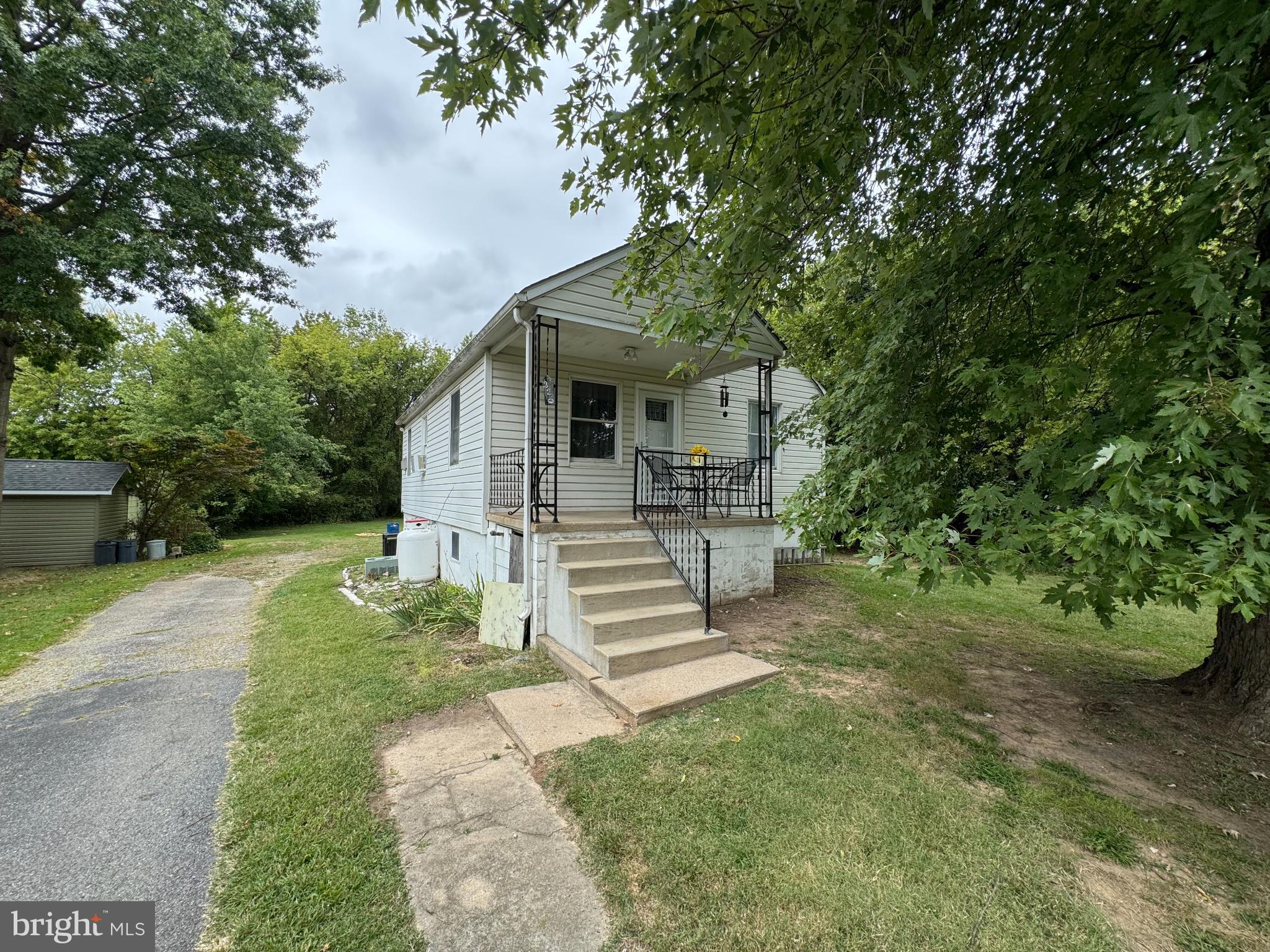 320 Harding Avenue Baltimore, MD 21220 - Photo 2 of 23 a front view of a house with a yard