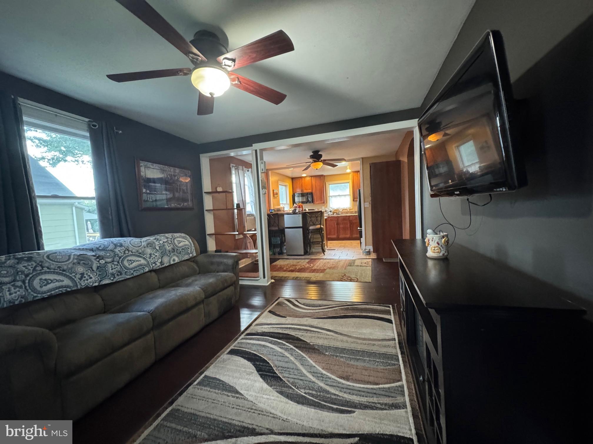 320 Harding Avenue Baltimore, MD 21220 - Photo 3 of 23 a living room with furniture and a flat screen tv