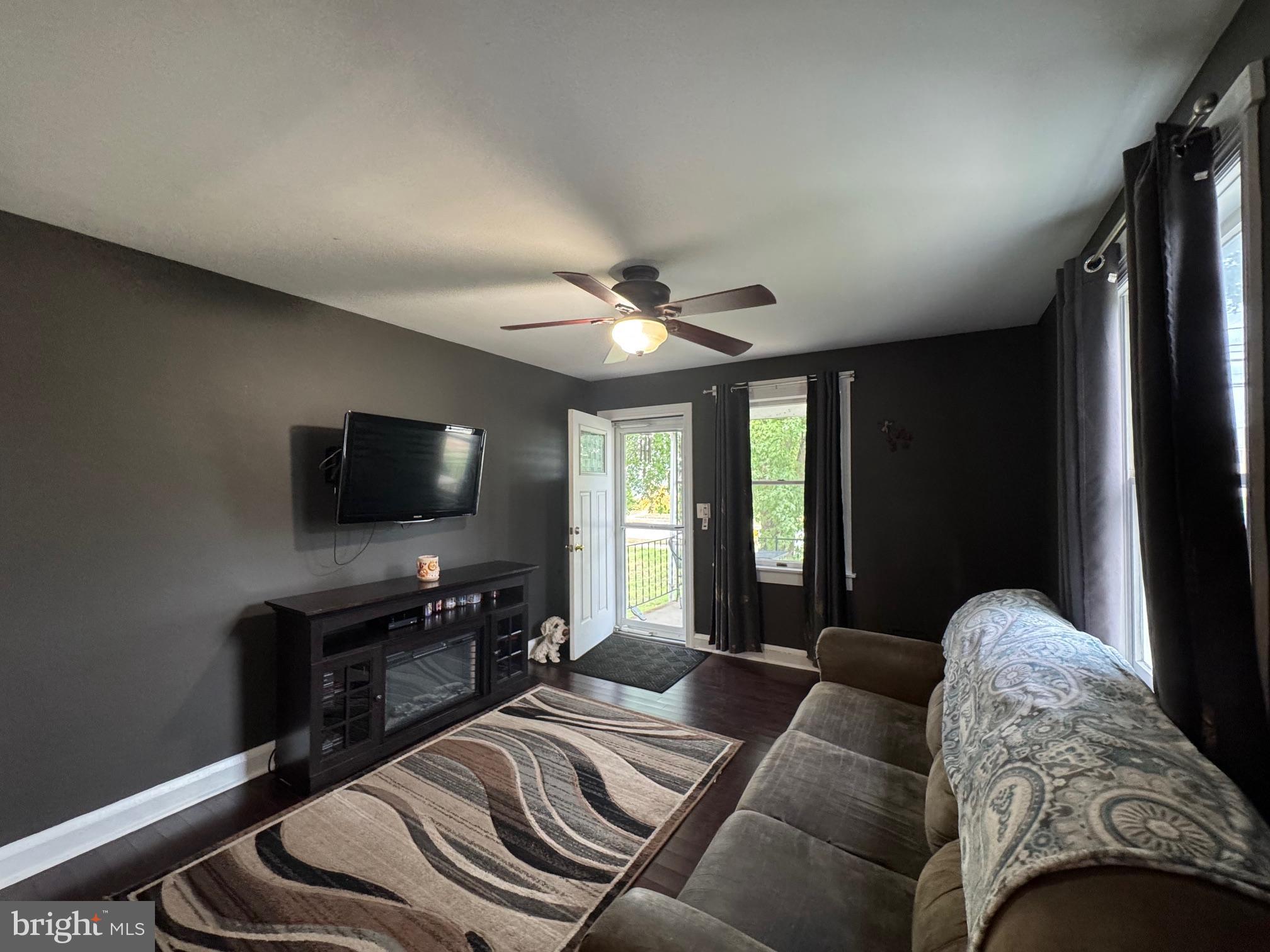 320 Harding Avenue Baltimore, MD 21220 - Photo 4 of 23 a living room with furniture and a flat screen tv