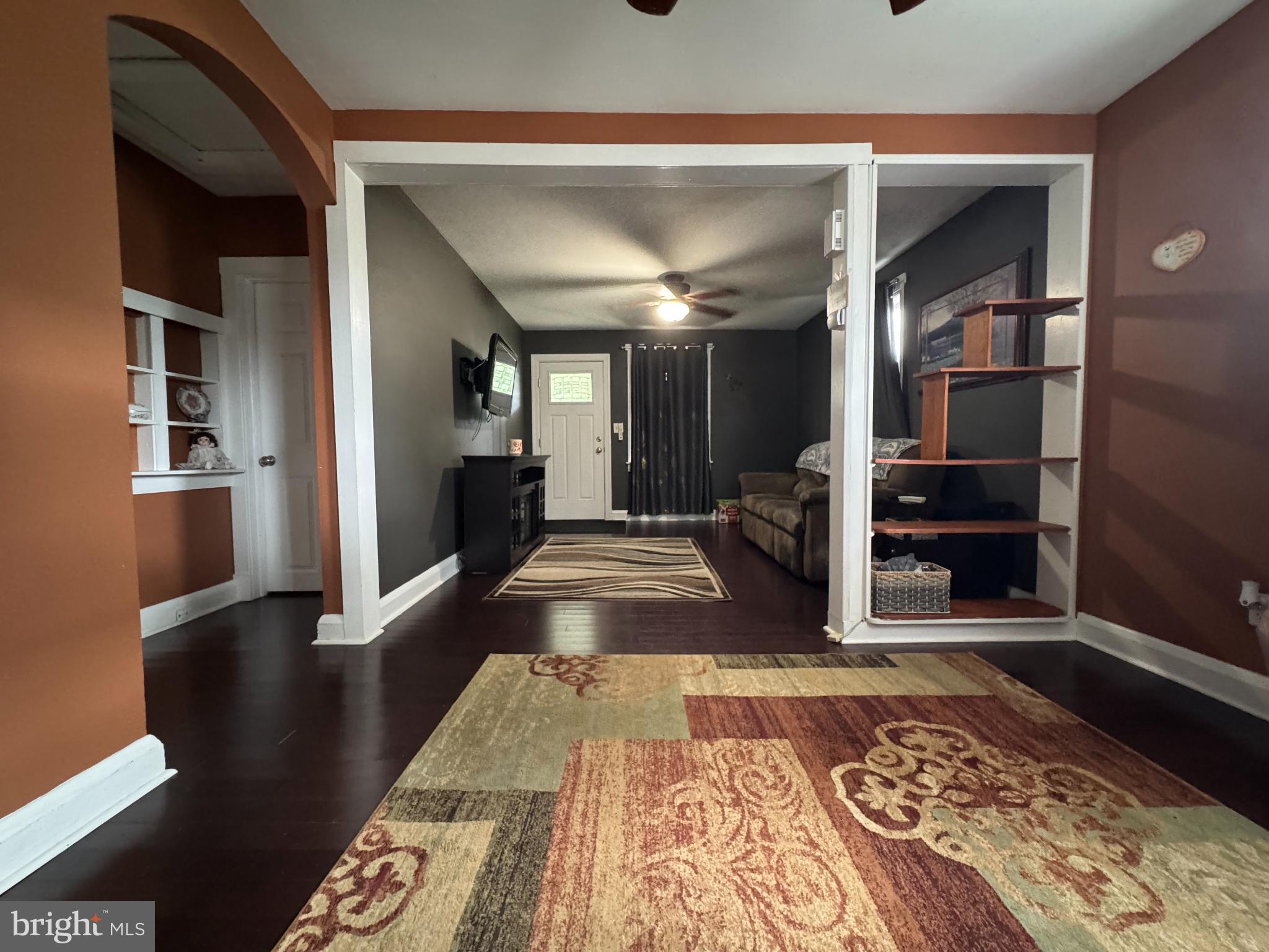 320 Harding Avenue Baltimore, MD 21220 - Photo 7 of 23 a large hall with wooden floor and a rug