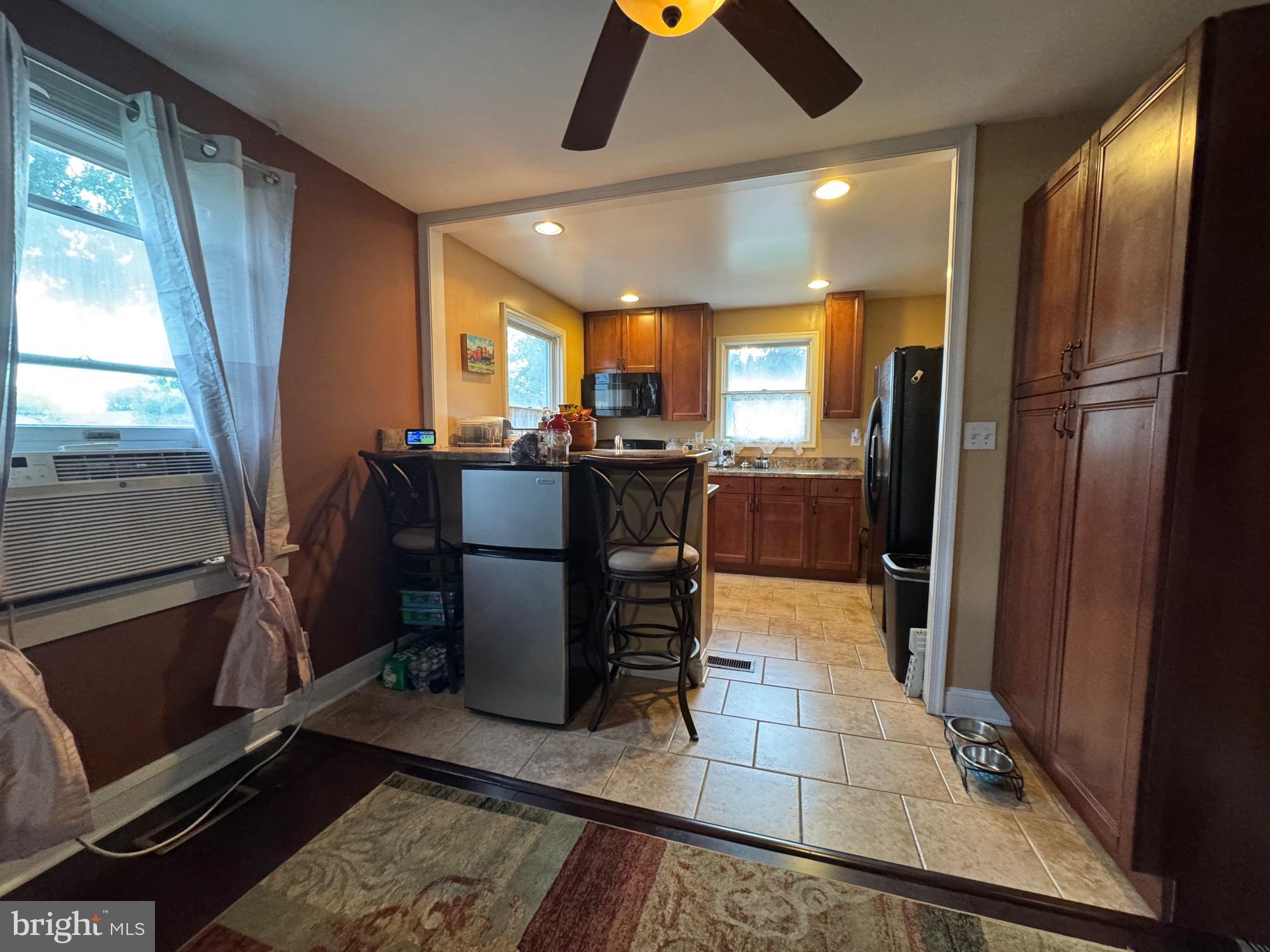 320 Harding Avenue Baltimore, MD 21220 - Photo 8 of 23 a kitchen with stainless steel appliances granite countertop a refrigerator and a stove