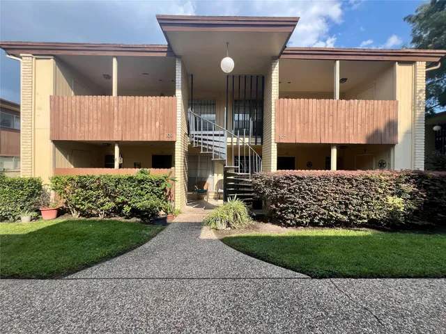 a view of a house with a small garden