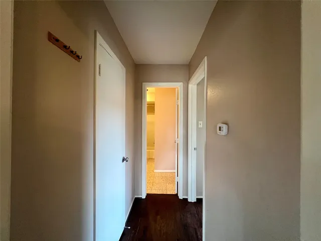 a view of a hallway with a bedroom