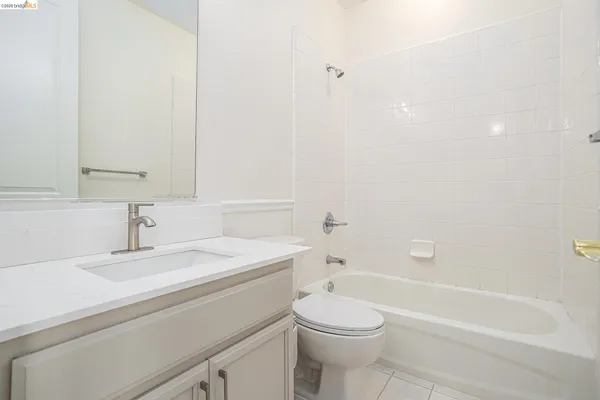 a bathroom with a sink a toilet and a bathtub