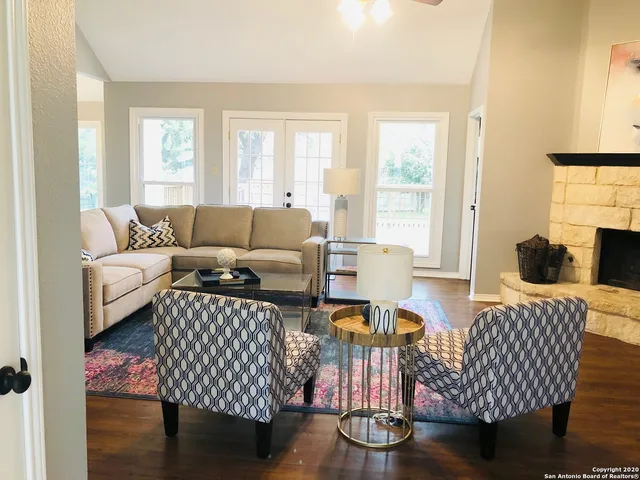 a living room with furniture or couch and a window