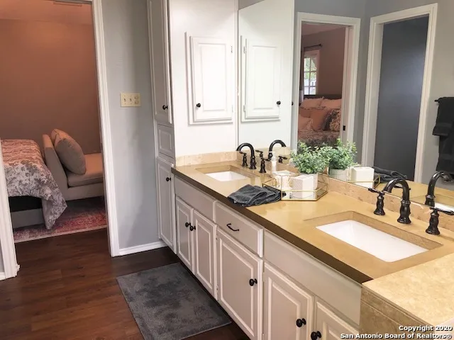 a bathroom with a sink and a mirror