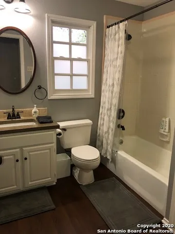 a bathroom with a toilet a sink and a bathtub