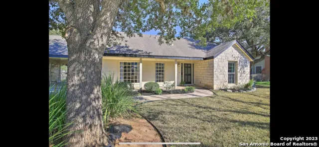 a front view of a house with outdoor seating
