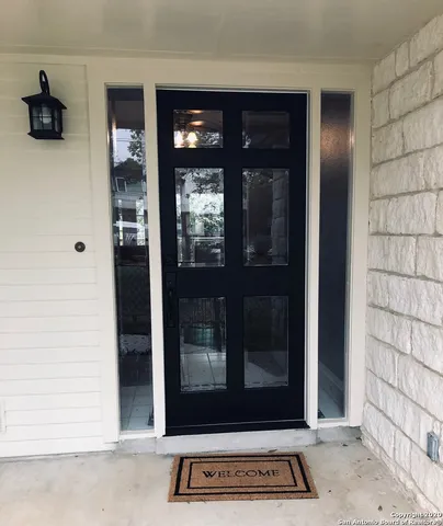 a view of a door and a window