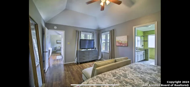 a bedroom with furniture and a chandelier