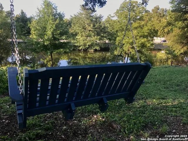 a wooden fence with trees in the background