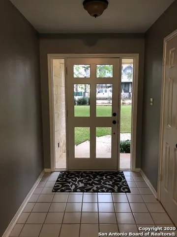 a view of a room with windows and view of a room