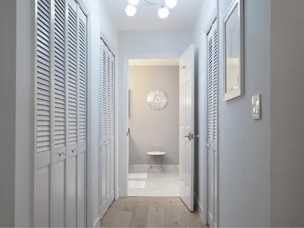a view of a bathroom with a toilet and a shower curtain