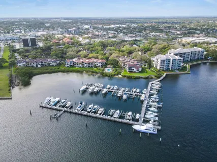 an aerial view of a houses with a lake