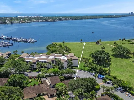 an aerial view of a houses with a lake view