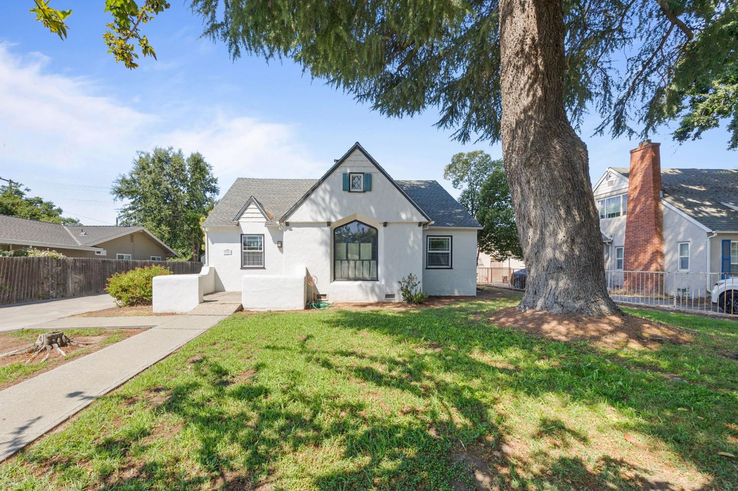 103 5th Street Arbuckle, CA 95912 - Photo 1 of 1 a front view of a house with garden