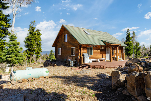 706 Tranquility Drive Springdale, UT 84767 - Photo 26 of 55 Log Cabin Charm: A beautiful side profile showing the rock foundation and timber work.