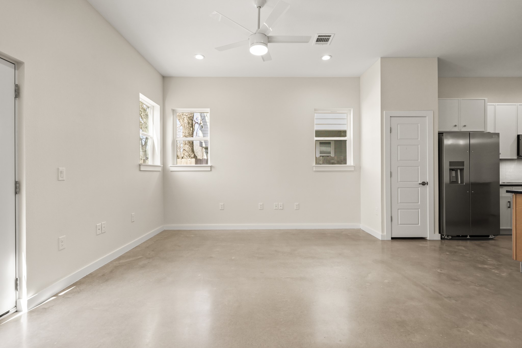 4801 Sara Drive, Unit A Austin, TX 78721 - Photo 8 of 40 an empty room with windows and closet