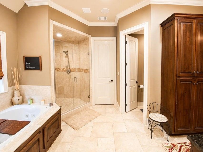 295 North Ridge Drive Saltillo, MS 38866 - Photo 19 of 38 a bathroom with a granite countertop sink a toilet and shower