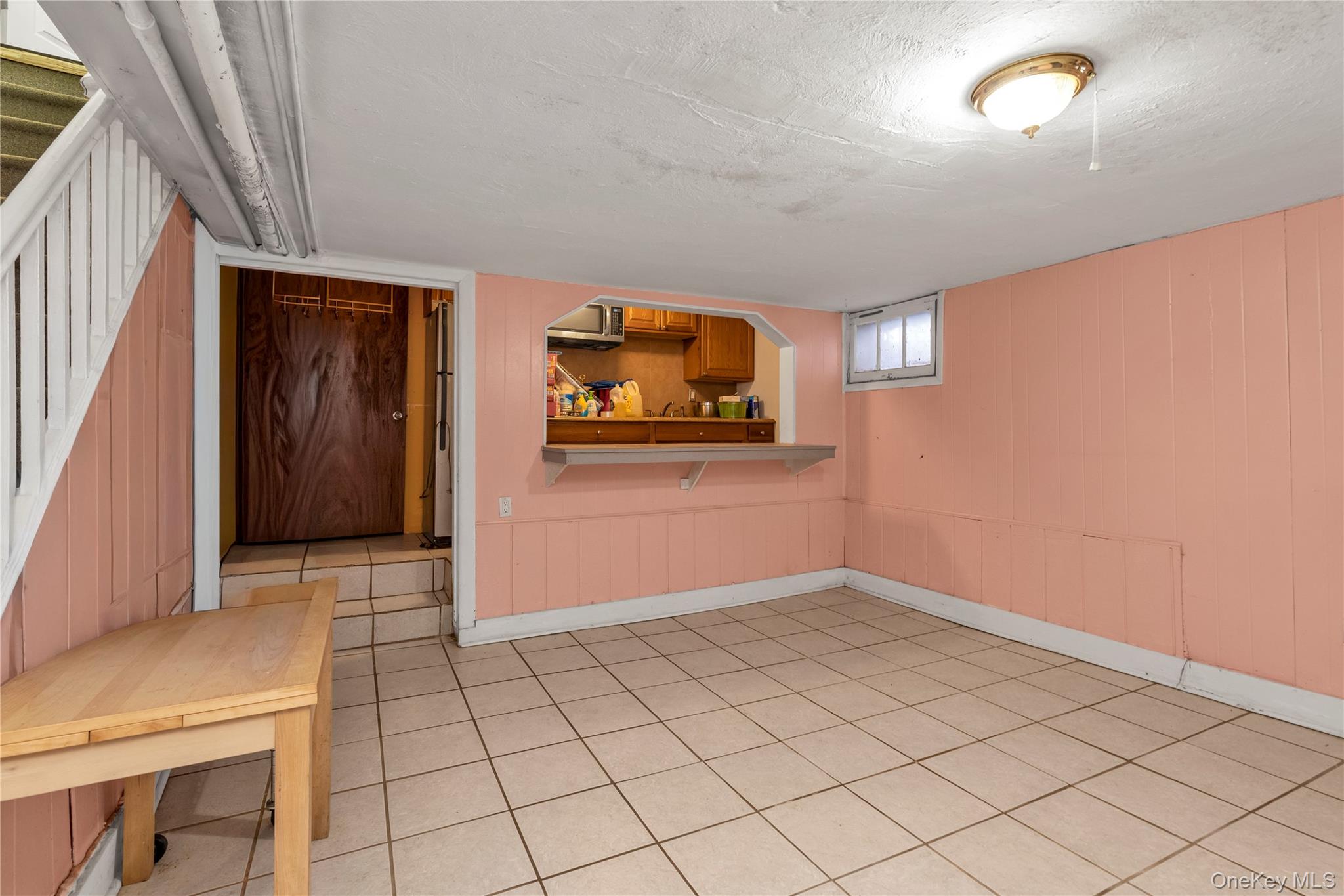 82-31 165th Street Queens, NY 11432 - Photo 12 of 16 a view of a livingroom with wooden floor and window